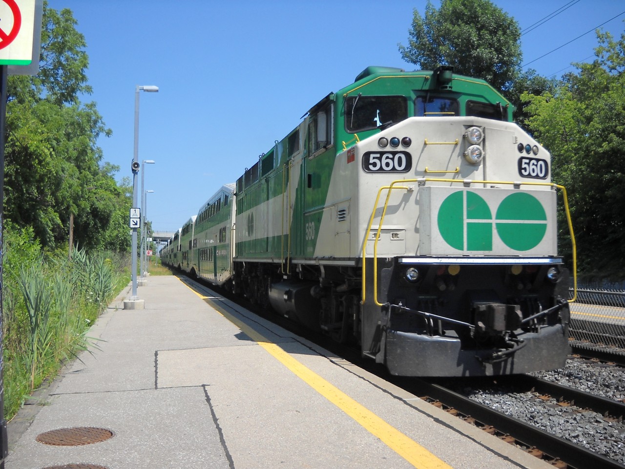  RevEd Photo: GO Transit F59PH #560, one of the last F59PH  units in its fleet, is shown heading west as it pulls into Long Branch  station with a 10 car