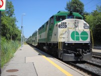 GO Transit F59PH #560, one of the last F59PH units in its fleet, is shown heading west as it pulls into Long Branch station with a 10 car consist, and F59PH #559 trailing.  #560 is located, and replacing, a cab car which normally would be used when trains are heading west on the Lakeshore line.