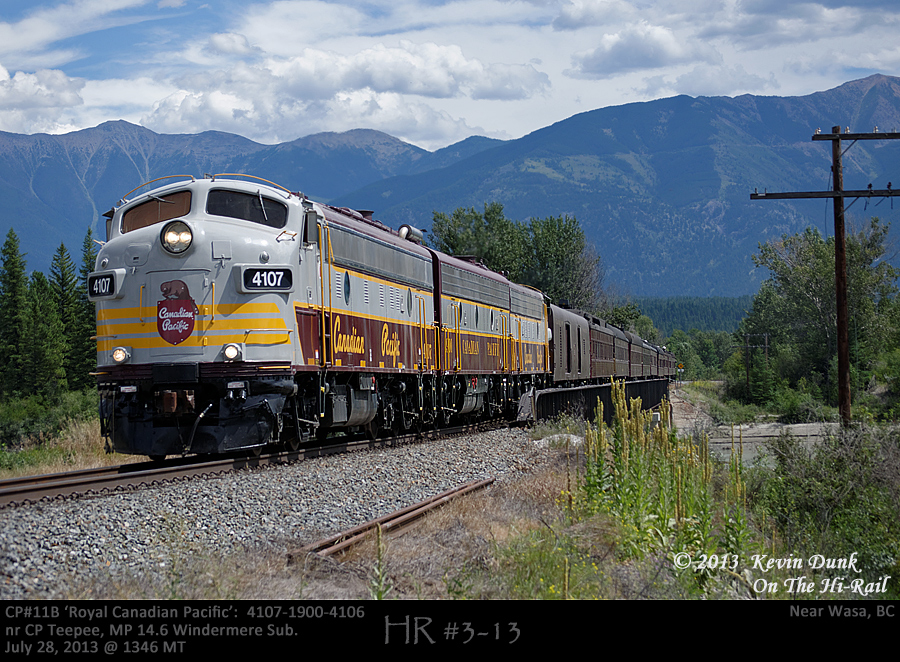 Running late, with the Canadian Rockies as a backdrop CP's Royal Canadian Pacific with 4107-1900-4106 are seen crossing the Kootenay River bridge on it's way north to Golden.