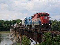 SOR X596 crosses the Grand River at Caledonia with RLK 4057 and CEFX 2006 in charge of a train of wind turbine blades destined for Nanticoke Ontario.  The blades will be offloaded in Nanticoke and transported by truck to the location's that the turbines are being erected at.  <br> Thanks to fellow RP.ca contributor James Gardiner for the heads up.