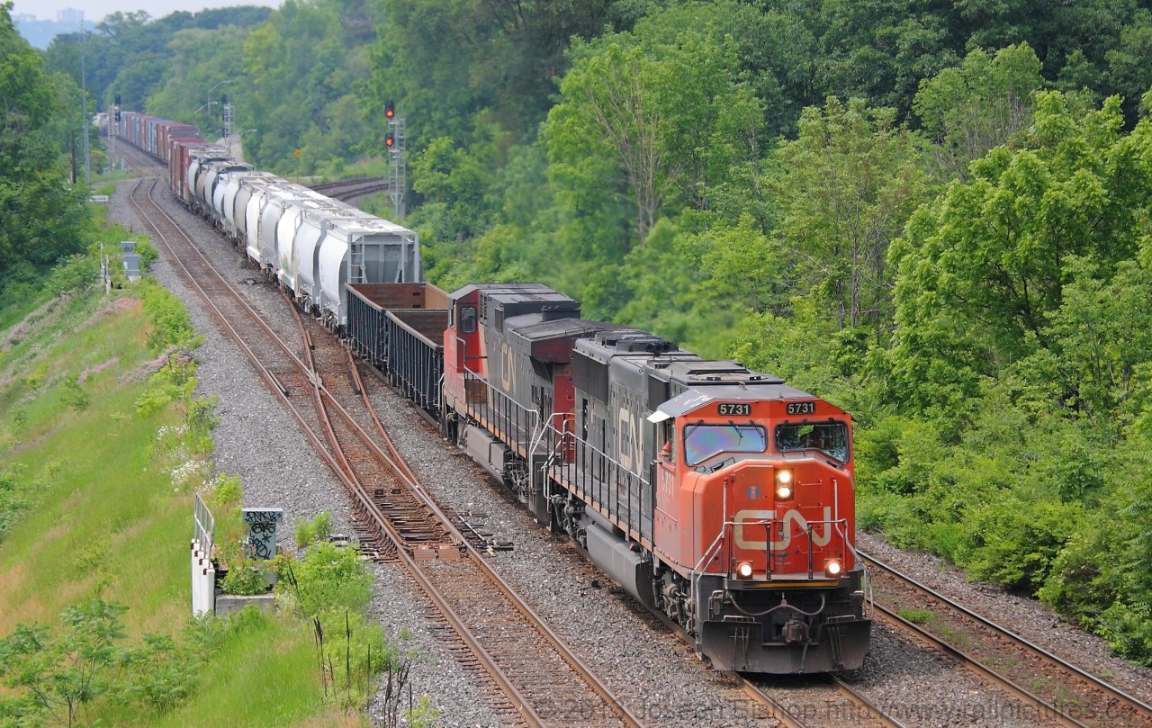 CN 422 makes its way through Bayview Junction with a SD75i in the lead and a large train in tow.  They will have work at Aldershot just a little down the line.