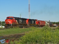 ES44DC 2342 and DASH 9-44CW 2714 restart their westbound freight after a meet at Ardrossan.