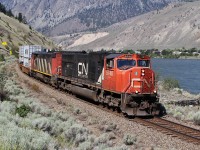 CN SD75I 8029 and Dash 8-40CM 2403 lead an intermodal through Spences Bridge as they travel east on CP Rail's Thompson Sub.