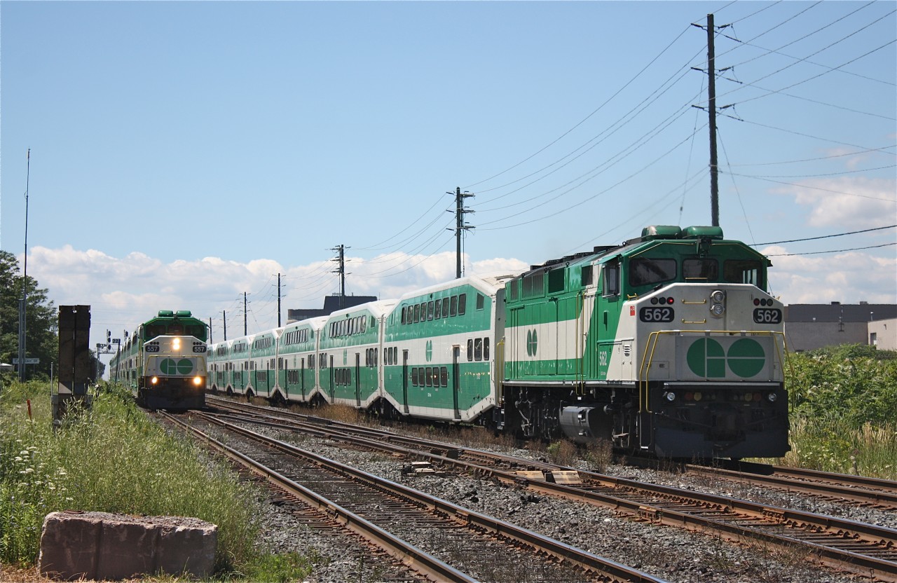 East and westbound GO trains meet at Kerr Street at 13:00. Half of GO Transits F59ph fleet can be seen in this photo with a F59PH on all end. GO Transits fleet of F59PHs once numbered 49 units, today it is down to only 8 making this photo hard to duplicate.