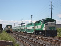 East and westbound GO trains meet at Kerr Street at 13:00. Half of GO Transits F59PH fleet can be seen in this photo with a F59PH on all end. GO Transits fleet of F59PHs once numbered 49 units, today it is down to only 8 making this photo hard to duplicate. 