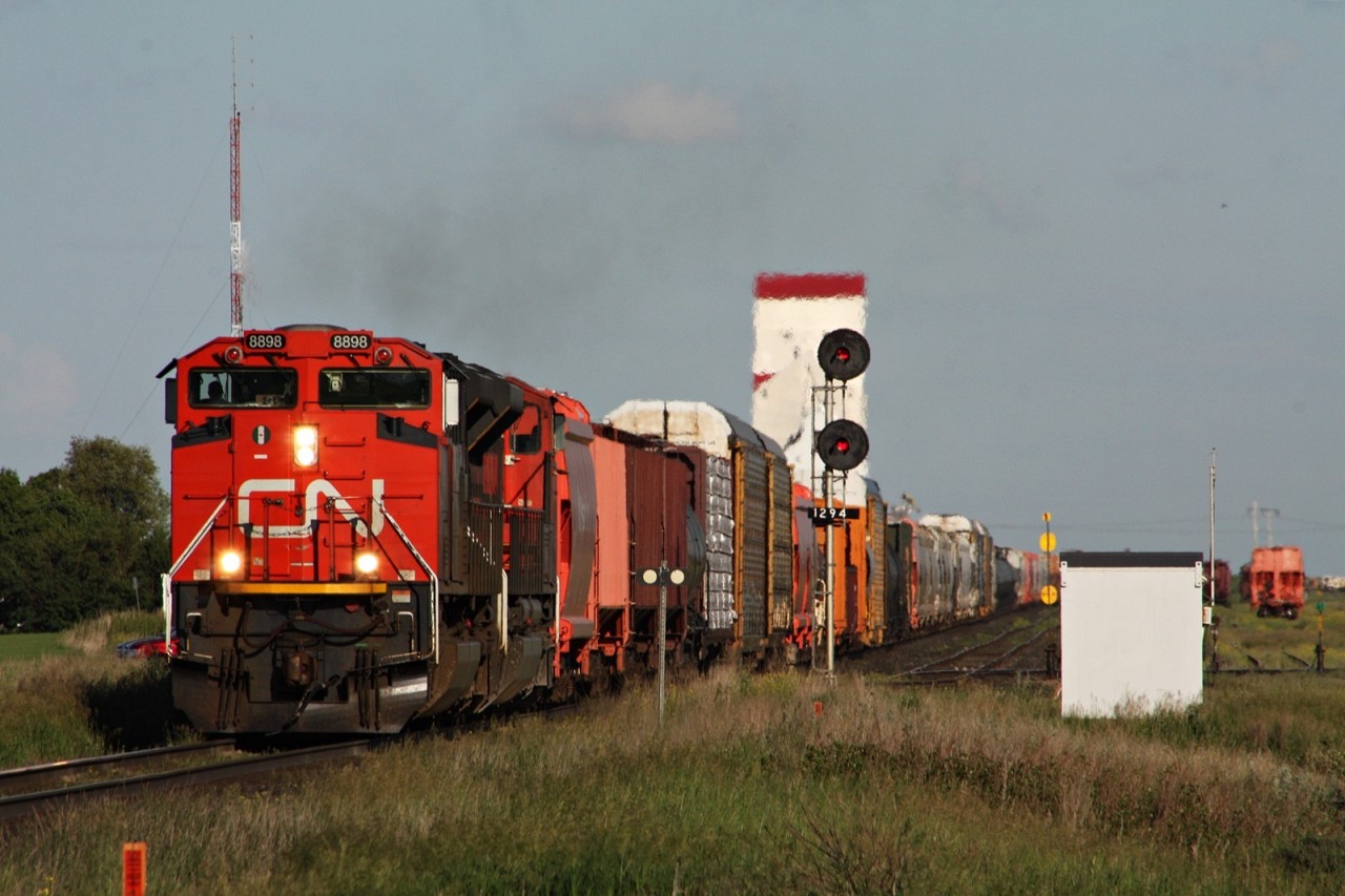 CN 8898 and sister lead 117 out of Watrous Saskatchewan after getting a fresh crew.