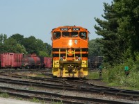 An almost perfectly matched set of wide-nose Huron Central GP40-2s (the third unit is a GP40-2L with the taller frame) switches cars at the Huron Central yard in Sault Ste. Marie.