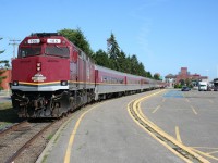 The Agawa Canyon Tour unloads passengers at the Algoma Central Railway station in Sault Ste. Marie after completing another run to Agawa Canyon park. 

The handsome red sandstone structure beyond the far end of the train is the original Algoma Central Railway station and office building. No longer used by the railway, this structure is now a bank.