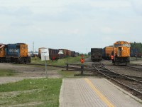 While GP38-2 1801 switches local cars at left, train 213 from Englehart has just arrived with SD75i 2102. After wying the engine, the 2102 will leave again for Englehart on train 414.