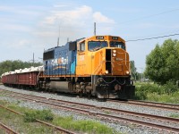 ONT 2104 south, train 308 from Kidd near Timmins, charges through Matheson with a long string of gondolas in copper concentrate service.