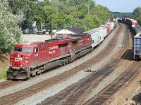 Canadian Pacific train 119 with grain empties and priority intermodal traffic rolls through Sudbury, Ontario.