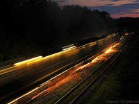 Loram RG309 puts on quite a show as it grinds the south track of the CN Kingston Sub just west of Port Hope, Ontario. 2127hrs.