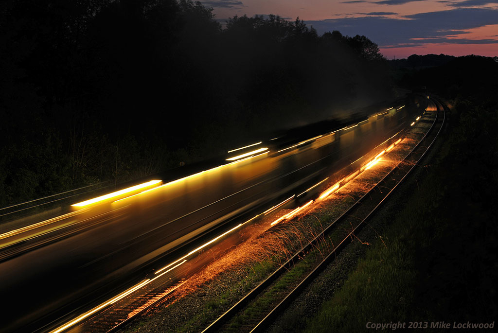 Loram RG309 puts on quite a show as it grinds the south track of the CN Kingston Sub just west of Port Hope, Ontario. 2127hrs.