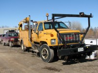 Maintenance is an important part of any railway, from big Class 1's and passenger carriers to shortlines and regions. Part of Ontario Southland Railway's vehicular maintenance fleet is seen parked at Guelph Junction: 93-12, a former CP Rail GMC TopKick truck with crane and maintenance body, and an older model Ford F150 pickup truck, both equipped with hi-rail gear for riding the rails.
<br><br>
<i>*Note: photographer was participating in restoration work on some equipment located on the (private) property with permission.</b>