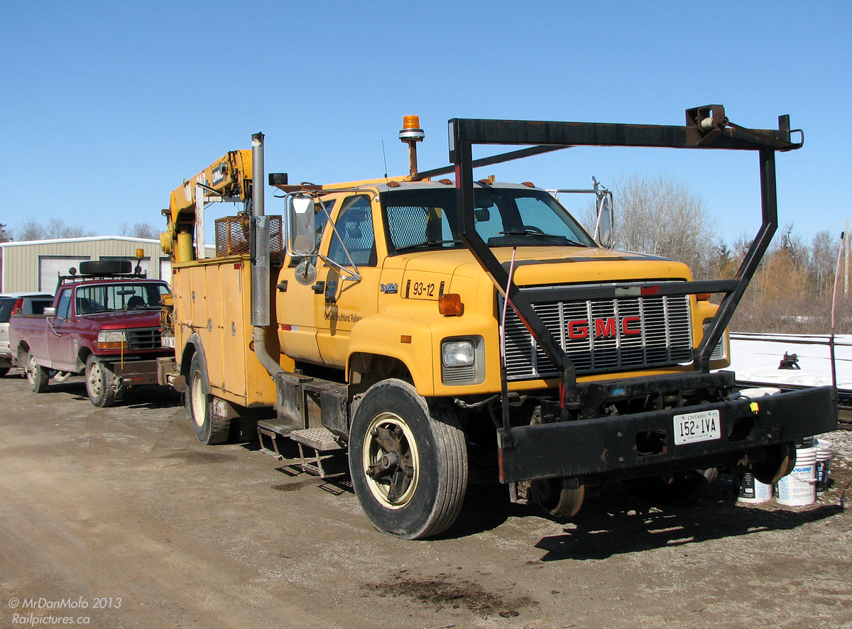 Maintenance is an important part of any railway, from big Class 1's and passenger carriers to shortlines and regions. Part of Ontario Southland Railway's vehicular maintenance fleet is seen parked at Guelph Junction: 93-12, a former CP Rail GMC TopKick truck with crane and maintenance body, and an older model Ford F150 pickup truck, both equipped with hi-rail gear for riding the rails.

*Note: photographer was participating in restoration work on some equipment located on the (private) property with permission.