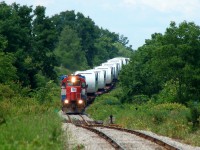 X596's conductor checking over the train as they approach 3rd line