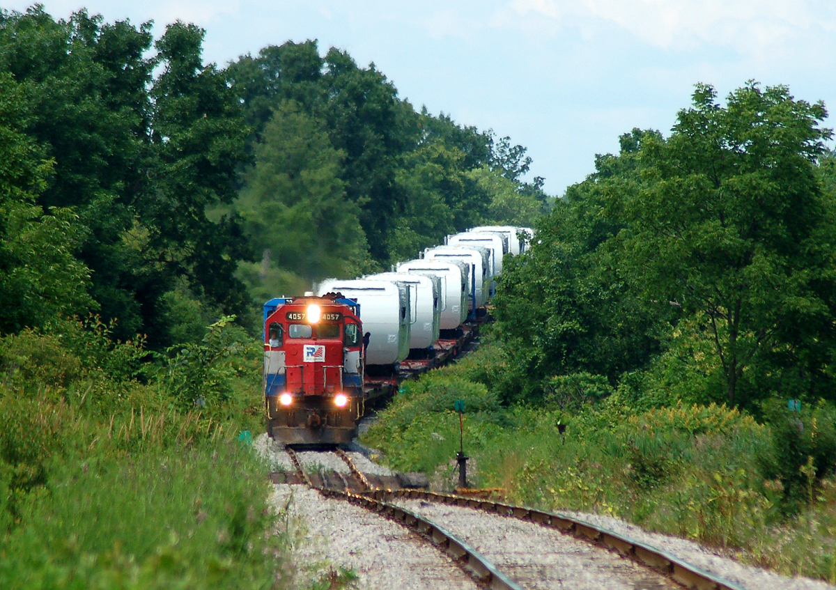 X596's conductor checking over the train as they approach 3rd line
