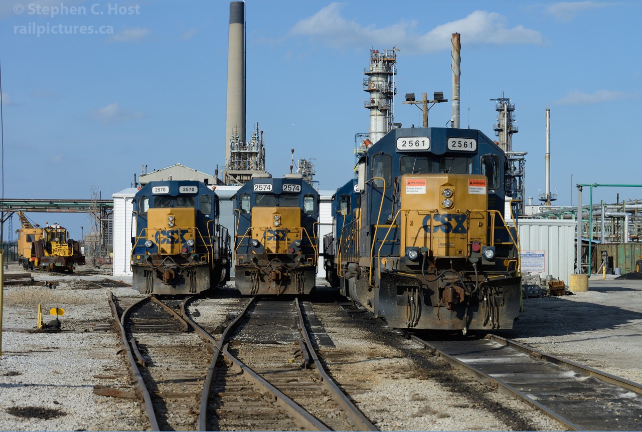 It's amazing that after all this time, with class 1's spinning off branches to Shortlines -  CSXT continues to operate an isolated portion of their network in Ontario, Canada. Once part of a larger C&O network, which formed an X between Buffalo-St. Thomas-Detroit, and Sarnia - Erieau all that is left is about 30 miles of trackage and a number of customers heavily concentrated within industrial Sarnia. At the Sarnia "Roundhouse" we find the following engines on-site in April 2013: 2570,2574, 2561, and behind 2561 is 2672. Looming behind the "roundhouse" and the station site is the sprawling Imperial Oil factory smokestacks, the plant itself having grown up around the Railways in the area.
Many railpictures.ca photographers have posted photos from the past and present of these operations and much more is sure to come over the years, see the suggested photos below for more!