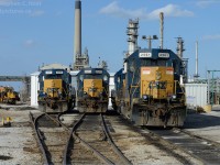 It's amazing that after all this time, with class 1's spinning off branches to Shortlines -  CSXT continues to operate an isolated portion of their network in Ontario, Canada. Once part of a larger C&O network, which formed an X between Buffalo-St. Thomas-Detroit, and Sarnia - Erieau all that is left is about 30 miles of trackage and a number of customers heavily concentrated within industrial Sarnia.<br><br> At the Sarnia "Roundhouse" we find the following engines on-site in April 2013: 2570,2574, 2561, and behind 2561 is 2672. Looming behind the "roundhouse" and the station site is the sprawling Imperial Oil factory smokestacks, the plant itself having grown up around the Railways in the area.<br><br>
Many railpictures.ca photographers have posted photos from the past and present of these operations and much more is sure to come over the years, see the suggested photos below for more!