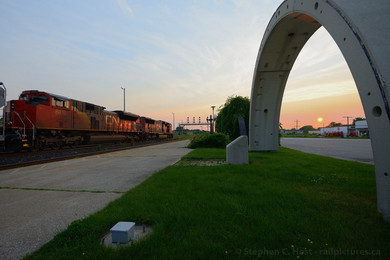 Like Stonehenge the Sarnia Tunnel segments at the Station signal the sun at or near the summer solstice - only for a brief few weeks a year does the sun lie on the north side of the railway in Sarnia. A westbound all EMD consist with SD75i 5768 and SD70M-2 8812 is taking the light at Hobson for the tunnel to the USA.