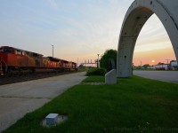 <b>Like Stonehenge</b> the Sarnia Tunnel segments at the Station signal the sun at or near the summer solstice - only for a brief few weeks a year does the sun lie on the north side of the railway in Sarnia. A westbound all EMD consist with SD75i 5768 and SD70M-2 8812 is taking the light at Hobson for the tunnel to the USA.