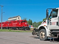 With the Canadian K3LR2 horn blaring on the lead GP38-2, CP T08 rolls through Clarington on this calm summers morning.