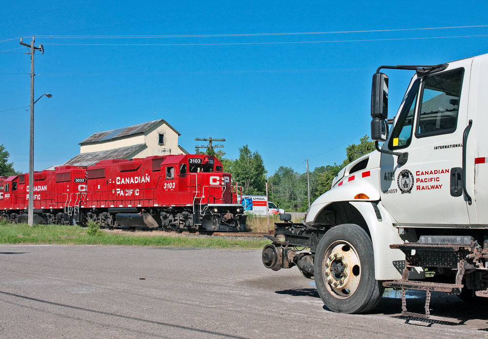 With the Canadian K3LR2 horn blaring on the lead GP38-2, CP T08 rolls through Clarington on this calm summers morning.