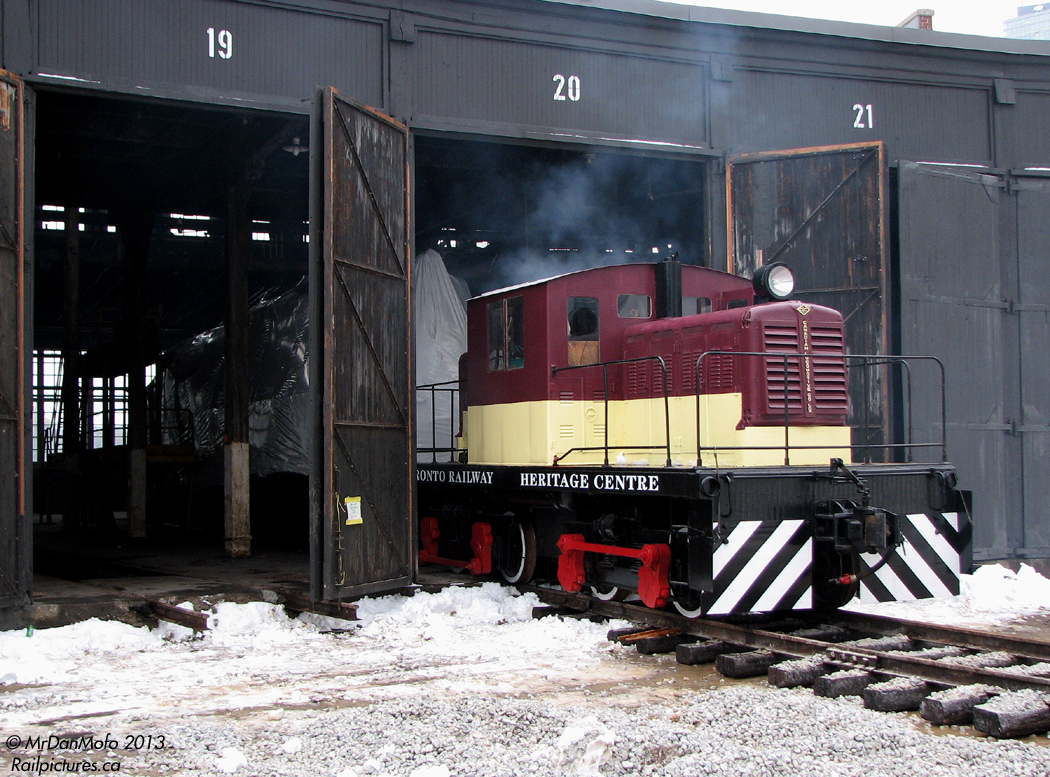 Back when the pieces of Toronto's "Roundhouse Park" were being put together leading up to its eventual opening to the public, we find smokey TRHC 50-tonner 1 shuffling equipment around a few months after the rebuilt and working air-powered turntable was returned and reinstalled. Coupled onto a tarped CN GP7 4803 that was previously stored outside, operator Michael Guy prepares to shove the 4803 further into Stall 20 of the former CPR John St. Roundhouse and tie them down for the day.  Interior photo of the little CLC-Whitcomb critter here. And there was more to catch on the way home: the CN CWR train.
