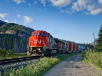 A pair of Dash 8s catch the last rays of sunshine, speeding west at 55mph or better with 178 platforms, 11594' of Chicago-Kamloops train.