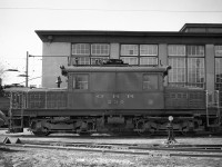 Grand River Railway electric freight motor 230 sits at the GRR's main shops in Preston ON (now part of the City of Cambridge).<br><br>The 230 - known as the "green hornet" by employees and fans - in this photo was painted green, later to be painted tuscan (like all other motors). It is a Baldwin-Westinghouse 'S' class motor (electric locomotives were commonly known as motors or juice jacks) built in 1930 and acquired by the GRR in 1946. This was the second-last S class motor built by Baldwin-Westinghourse. It was later sold to the Cornwall Street Railway as their 17, retired at the end of electric service in Cornwall in 1971, and today is on display near the Cornwall Transit garage.<br><br>This is the first image in a set of photos by the late William (Cecil) Hommerding of Jackson, MI who passed on in 1983, and attended a Sunday April 30th, 1950 NHRS excursion with a group of largely American railfans. These photos document this excursion as seen through Cecil's lens. Cecil used a 120-size twin-lens reflex camera for these photographs.<br><br>  Photo taken by Cecil Hommerding, from the collection (Copyright) of Doug Leffler.<br><br>Substantial caption information provided by George Roth et al with much thanks. <br><br><i><u>More interesting views:</u></i><br> An overview of the GRR's Preston Shops: <a href=http://www.railpictures.ca/?attachment_id=10413><b>http://www.railpictures.ca/?attachment_id=10413</b></a><br> LE&N motor 333 at the shops: <a href=http://www.railpictures.ca/?attachment_id=10747><b>http://www.railpictures.ca/?attachment_id=10747</b></a><br> The fantrip special at Kitchener: <a href=http://www.railpictures.ca/?attachment_id=10681><b>http://www.railpictures.ca/?attachment_id=10681</b></a>