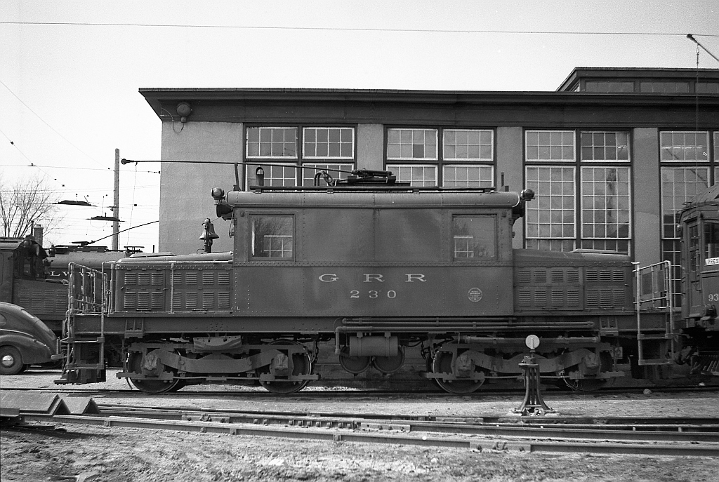 Grand River Railway electric freight motor 230 sits at the GRR's main shops in Preston ON (now part of the City of Cambridge).The 230 - known as the "green hornet" by employees and fans - in this photo was painted green, later to be painted tuscan (like all other motors). It is a Baldwin-Westinghouse 'S' class motor (electric locomotives were commonly known as motors or juice jacks) built in 1930 and acquired by the GRR in 1946. This was the second-last S class motor built by Baldwin-Westinghourse. It was later sold to the Cornwall Street Railway as their 17, retired at the end of electric service in Cornwall in 1971, and today is on display near the Cornwall Transit garage.This is the first image in a set of photos by the late William (Cecil) Hommerding of Jackson, MI who passed on in 1983, and attended a Sunday April 30th, 1950 NHRS excursion with a group of largely American railfans. These photos document this excursion as seen through Cecil's lens. Cecil used a 120-size twin-lens reflex camera for these photographs.  Photo taken by Cecil Hommerding, from the collection (Copyright) of Doug Leffler.Substantial caption information provided by George Roth et al with much thanks. More interesting views: An overview of the GRR's Preston Shops: http://www.railpictures.ca/?attachment_id=10413 LE&N motor 333 at the shops: http://www.railpictures.ca/?attachment_id=10747 The fantrip special at Kitchener: http://www.railpictures.ca/?attachment_id=10681
