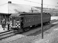 Grand River Railway car 842 stops at Paris Station for a photo view, with riders having a look around, during a fantrip excursion on the line (note the "Special" signage in the windows). The station, located at milepost 13.3 of the line and built during 1916, was demolished during the early 1980s. Passenger service on the GRR ended in 1955, five years after this photo was taken.<br><br> Photo taken by Cecil Hommerding, from the collection (Copyright) of Doug Leffler. Substantial caption information provided by George Roth et al with much thanks. <br><br> <i><u>More views of the fantrip:</u></i><br> 842 crossing the bridge at Waterford: <a href=http://www.railpictures.ca/?attachment_id=10357><b>http://www.railpictures.ca/?attachment_id=10357</b></a><br> The fantrip stopping at Kitchener: <a href=http://www.railpictures.ca/?attachment_id=10681><b>http://www.railpictures.ca/?attachment_id=10681</b></a><br> 842 and 848 MU'ed for the return trip: <a href=http://www.railpictures.ca/?attachment_id=10746><b>http://www.railpictures.ca/?attachment_id=10746</b></a> <br><br> For more details on Cecil, see <a href=http://www.railpictures.ca/?attachment_id=10297><b>here</b></a>.