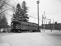 Grand River Railway car 848 is on the daily every 15 minute return trip to Hespeler, pictured at King Street in Preston, Ontario from the Preston Junction Station front area. This view is looking southeast, with the entrance to Riverside park on the left, the crossing that the car is on. To the extreme left was the site of the GRR Preston shops, not shown.<br><br>By the sunlight, this photo was shot just after lunch. Many years earlier, these cars crossed and rode up the centre of the King Street on the bridge over the Speed River on the right. That route was abandoned in 1939 in favour of the route you see here which survives today as the CPR Waterloo subdivision, hauling 6000' automotive trains to the Toyota plant. Passenger service was discontinued in 1955, and electric operations ended in 1961 in favour of diesels from GRR parent CPR. Today that large Preston Furniture Company factory building in the background is also long gone, destroyed by fire. In place there are a two 18 floor Condo towers. <br><br> Photo taken by Cecil Hommerding, from the collection (Copyright) of Doug Leffler. Substantial caption information provided by George Roth et al with much thanks.<br><br><i><u>More interesting views:</u></i><br> 848 and 842 combined at Hespeler: <a href=http://www.railpictures.ca/?attachment_id=10746><b>http://www.railpictures.ca/?attachment_id=10746</b></a><br> An overview of the GRR's Preston Shops: <a href=http://www.railpictures.ca/?attachment_id=10413><b>http://www.railpictures.ca/?attachment_id=10413</b></a><br> LE&N motor 333 at the shops: <a href=http://www.railpictures.ca/?attachment_id=10747><b>http://www.railpictures.ca/?attachment_id=10747</b></a> <br><br> For more details on Cecil, see <a href=http://www.railpictures.ca/?attachment_id=10297><b>here</b></a>.