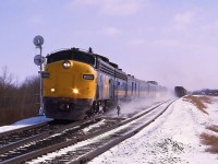 In March 1987 FP9(A) VIA 6502 speeds through Ardrossan with train #3 the Supercontinental kicking up the late spring snow.