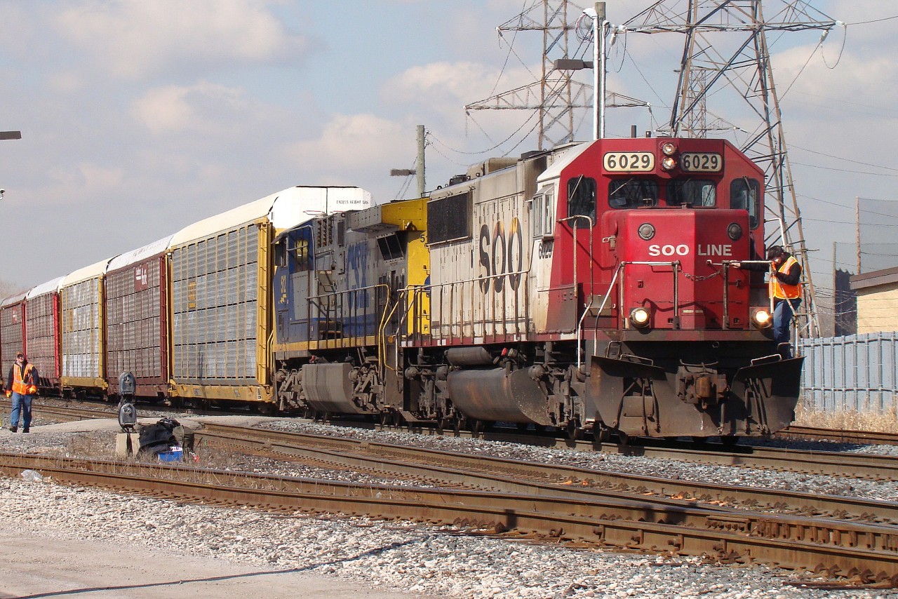 Crew change at Dougall Ave. with SOO 6029 and CSX 512 in command of this solid set of eastbound autoracks.