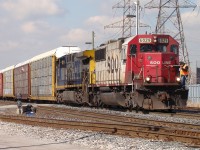 Crew change at Dougall Ave. with SOO 6029 and CSX 512 in command of this solid set of eastbound autoracks.