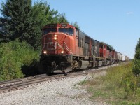 A hugely overpowered CN 407 at Painsec West on the Springhill Sub with 4 big EMDs hauling all but 25 cars on this beautiful Sunday afternoon.