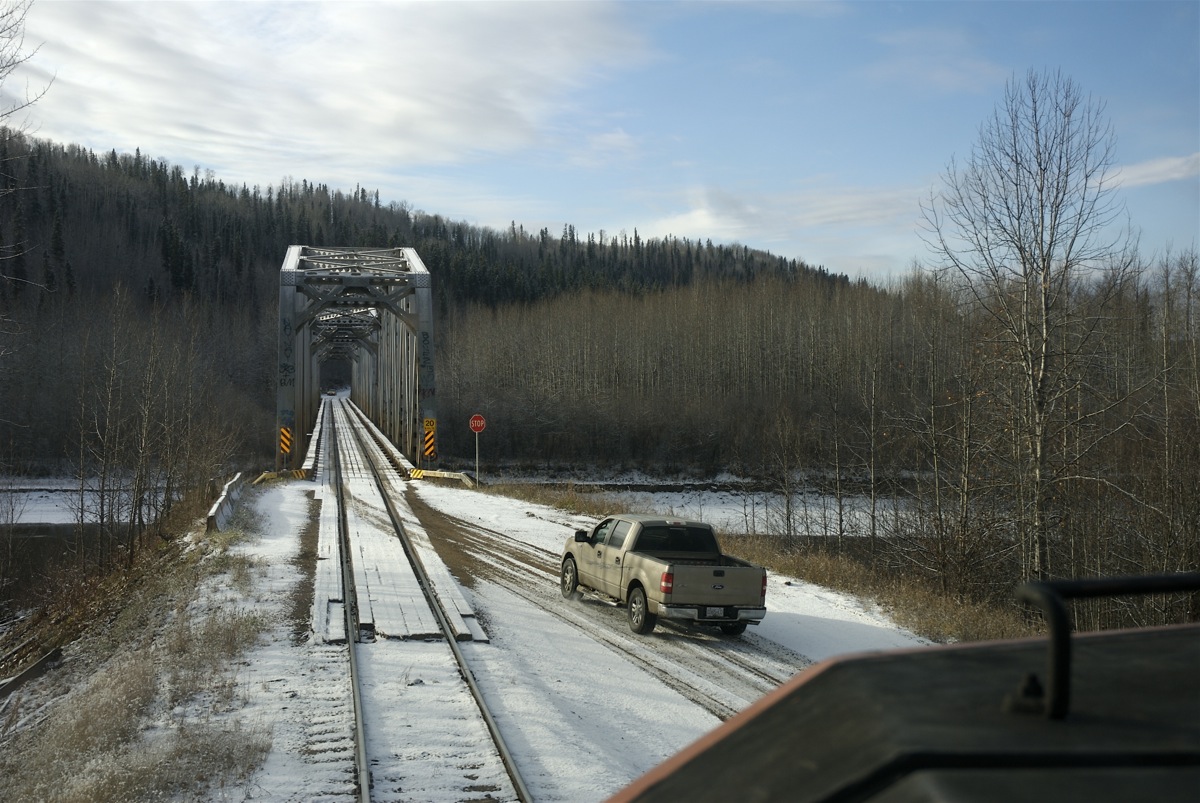 Some times even trains need to wait there turn. Train 478 is just about to leave Fort Nelson and begin the 250 mile journey to Fort St John, but first we must stop at the river bridge and wait for highway traffic to clear. I don't think there are too many other operations like this on the CN system.