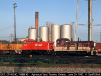 For those that like switchers, here's a variety for you.  TH&B NW2 #51, now part of Ontario Southland's roster, CP SW1200RSu #1240, and Union Pacific SW10 #1267 share some quality time together in Agincourt Yard in Toronto back in June of 1993.  UP 1267 was apparently supposed to have been setoff in Chicago off of a 500 train, but crews failed to do so and it ended up making it all the way to Toronto before someone caught the mistake.  Bad for the crews, but good for Railfans.