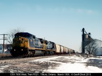 CSX 7850 West, Train R321, rolls through Tilbury, Ontario on CASO rails as it runs from Buffalo to Detroit back in 1995. This is 18 years ago and it's hard to believe that there are only two things in this picture that still exist at this location today, the white house immediately to the left, and the sky!!! No forward thinking by the railway or industry here, just simple "bottom line" mentality.