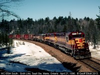 Wisconsin Central 6594 South leans into the curve at 6th Line as it makes it's approach to Sault Ste. Marie, Ontario in April of 1996.  Nice consist with 2 WC SD45's, an ex-Algoma Central GP38-2, and a WC (ex-MILW) SDL39 for power.