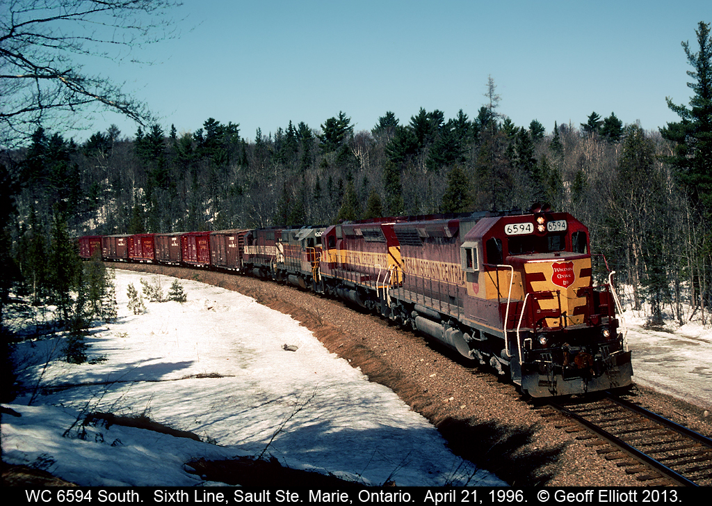 Wisconsin Central 6594 South leans into the curve at 6th Line as it makes it's approach to Sault Ste. Marie, Ontario in April of 1996.  Nice consist with 2 WC SD45's, an ex-Algoma Central GP38-2, and a WC (ex-MILW) SDL39 for power.