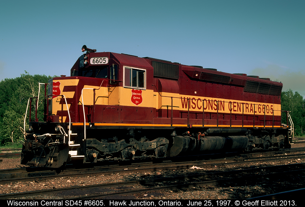 Wisconsin Central SD45 #6605 sits idle at Hawk Junction back in 1997.  This unit, along with an F45, will be lifted by the southbound freight shortly to make the trip back to Sault Ste. Marie.