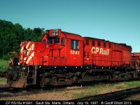 CP RS18u #1841 and SW1200RSu #1243 sit in the Huron Central yard in Sault Ste. Marie, Ontario.  Huron Central temporarily used CP power to run on the line from Sudbury to Sault Ste. Marie during the transition of operations from CP to Genesee Transportation.