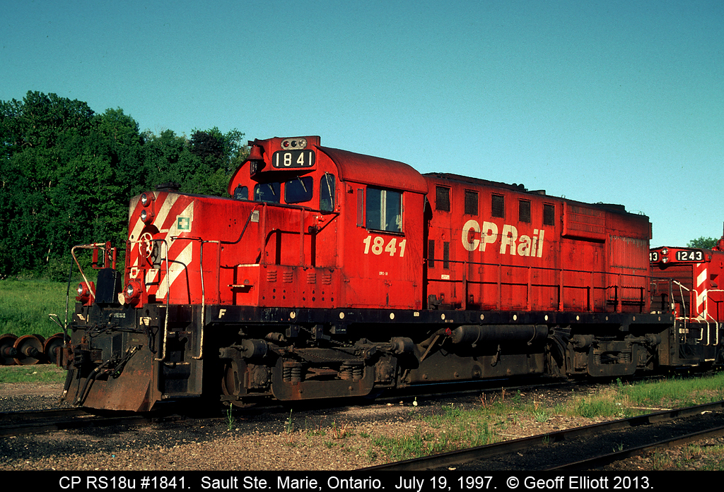 CP RS18u #1841 and SW1200RSu #1243 sit in the Huron Central yard in Sault Ste. Marie, Ontario.  Huron Central temporarily used CP power to run on the line from Sudbury to Sault Ste. Marie during the transition of operations from CP to Genesee Transportation.