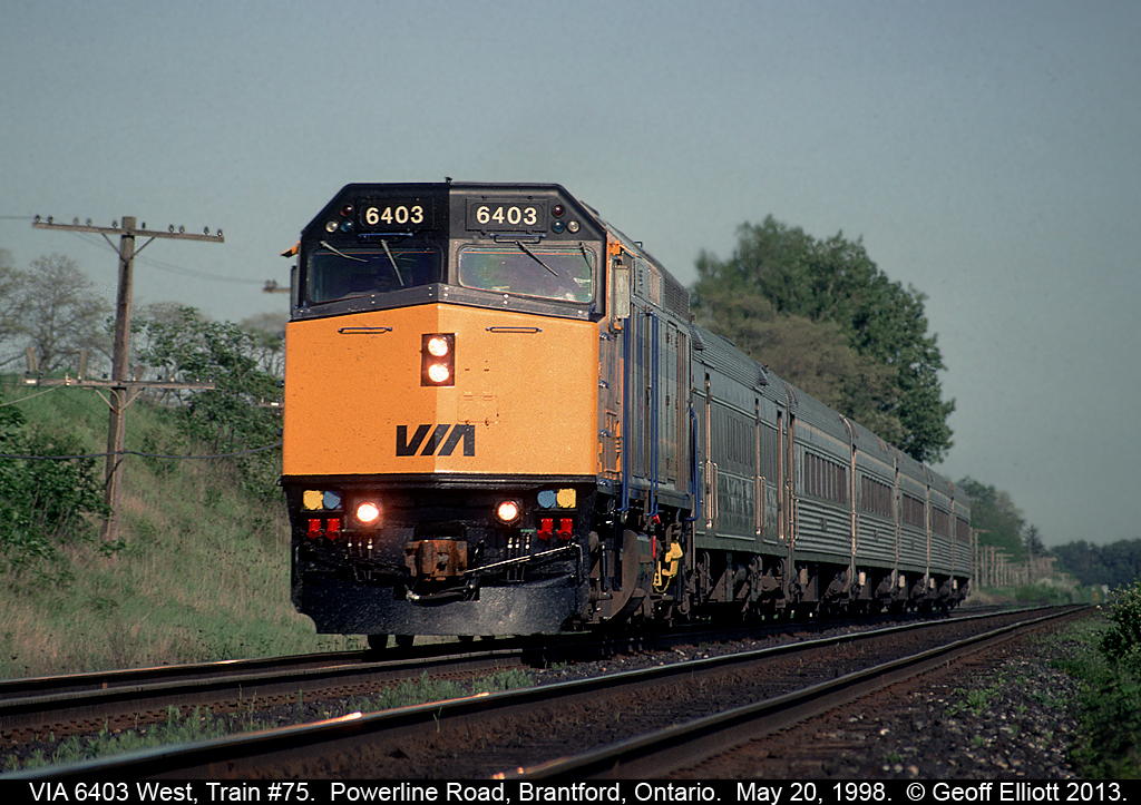 VIA 6403 has train #75 in hand as it speeds by on the Dundas Subdivision toward Paris, Ontario and points west.  6403 graces our new $10.00 bill and has since been renumbered 6459 to protect VIA's image should 6403 have ever been in an accident.  That's Lawyers for you...........