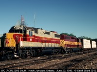An Algoma Central GP38-2, masquerading as Wisconsin Central #2006, and a WC GP40-2 are the power for today's local out of Hawk Junction and have their 2 car train in tow.  It's early morning in Hawk Junction and this power and train were setoff by the southbound freight last night to do work in and around Hawk Junction today.  I think it is sad how both the CN. and formerly the WC, let the former Algoma Central fall from it's former glory.