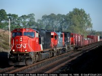 CN 5611 leads a nice westbound out of Brantford and is about to cross Powerline Road.  Nice to see a Grand Trunk unit in consist as well.