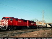 CP 'red barn' #9007 leads the westbound "Expressway" under Ouellette Ave. as it heads for the terminal next to the old Michigan Central station in Detroit, Michigan.  It's not really any surprise that the Expressway failed west of Toronto considering the lack of traffic it carried, as can be seen by the lone 2 trailers on this particular train.