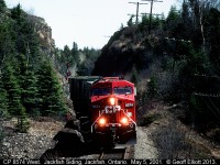 CP 8574 West passes through the rock cut and leans into the curve just west of Jackfish Siding on CP's Heron Bay subdivision.